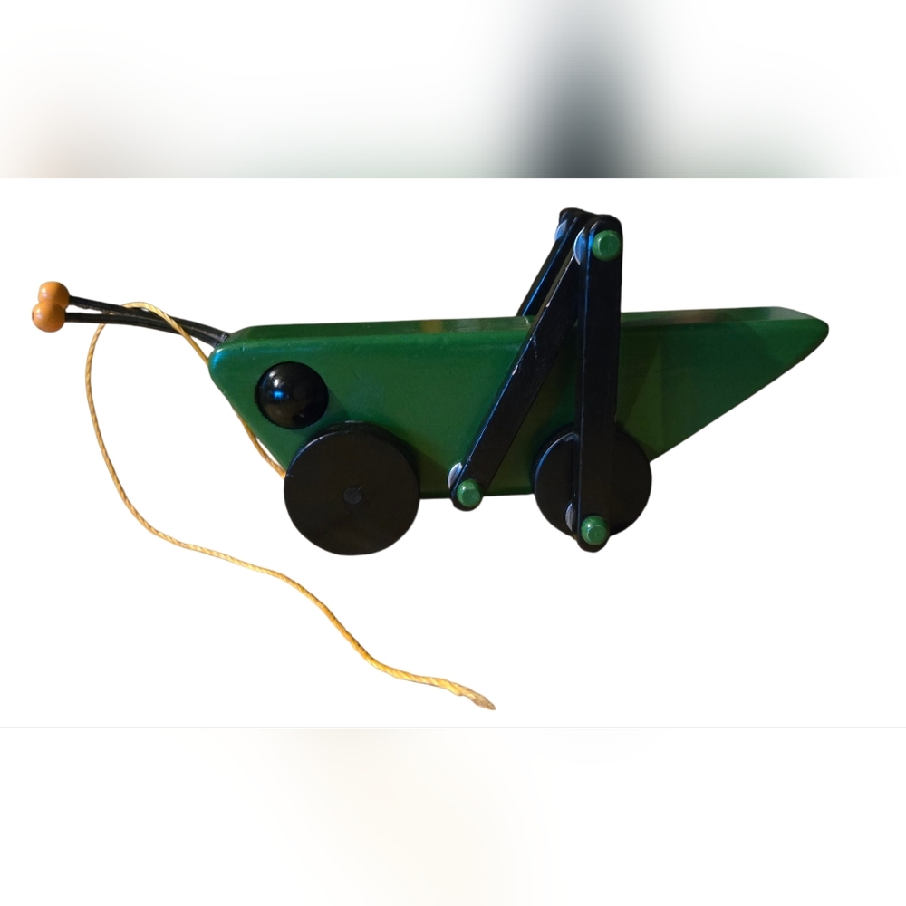 handcrafted wooden grasshopper pull toy
